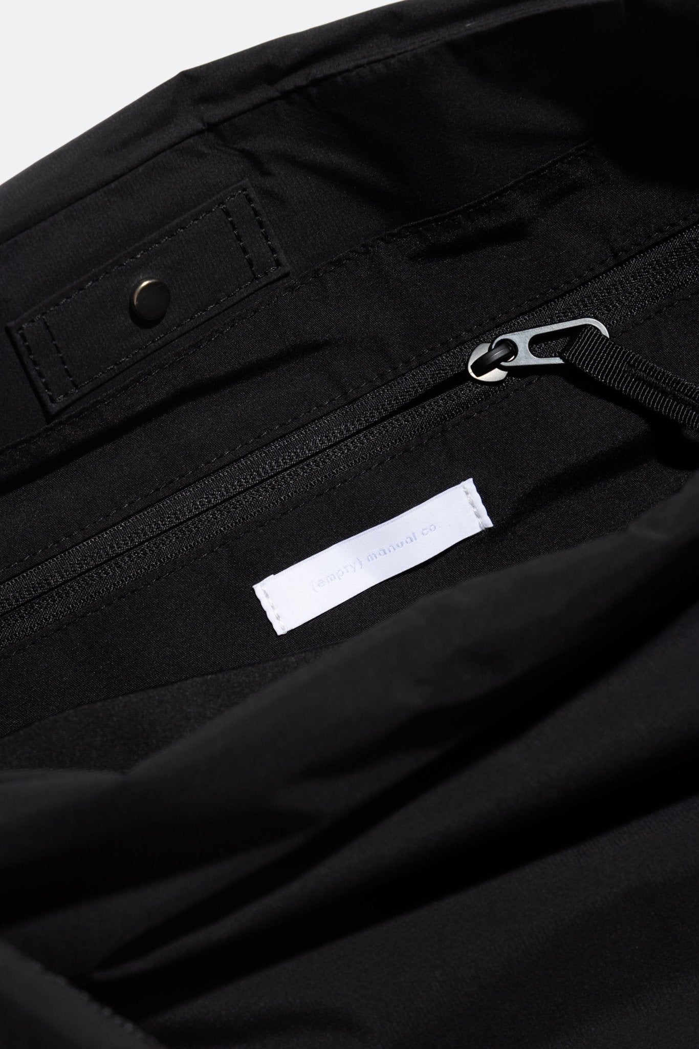 (empty) manual co. asymmetric padded bag/ matte black - GROGROCERY