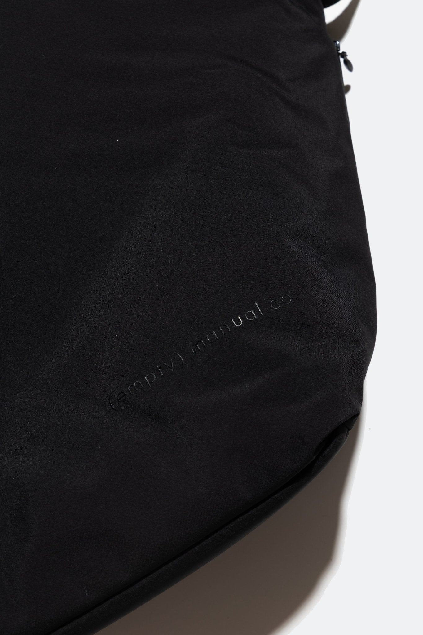 (empty) manual co. asymmetric padded bag/ matte black - GROGROCERY